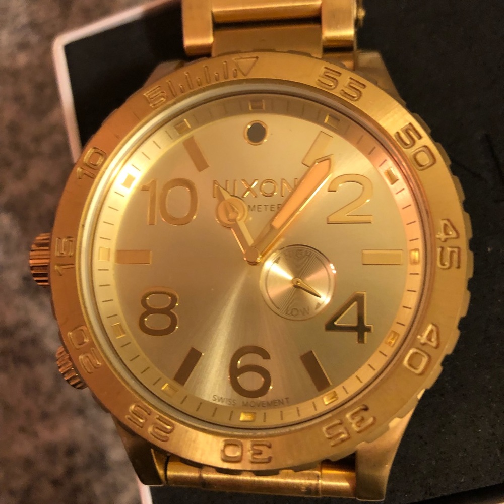 Men’s gold Nixon watch limited edition